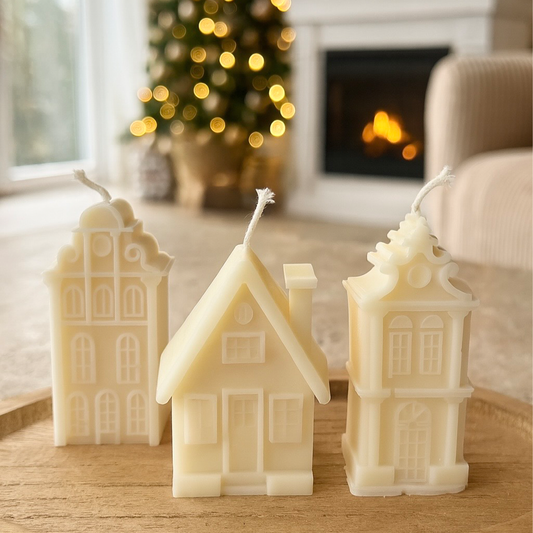 trois bougie en forme de maison